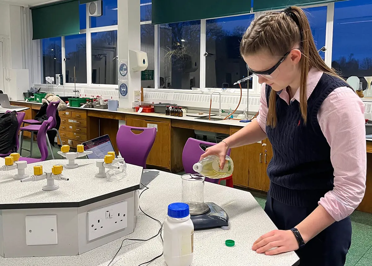 Kent College Canterbury student Rachel in science class conducting an experiment