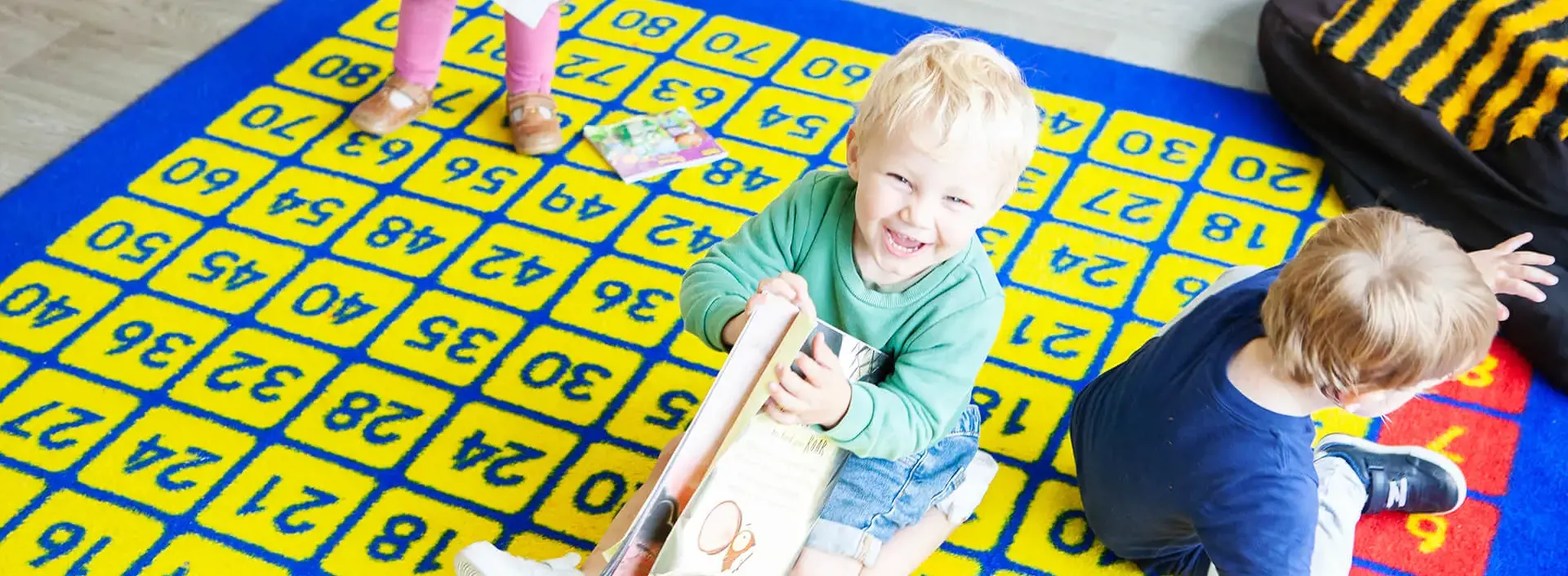 Nursery pupil on the playmat