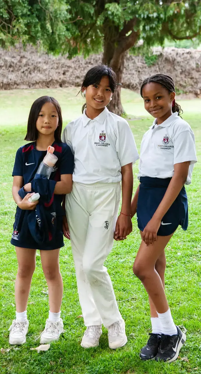 Junior school pupils wearing sports uniform