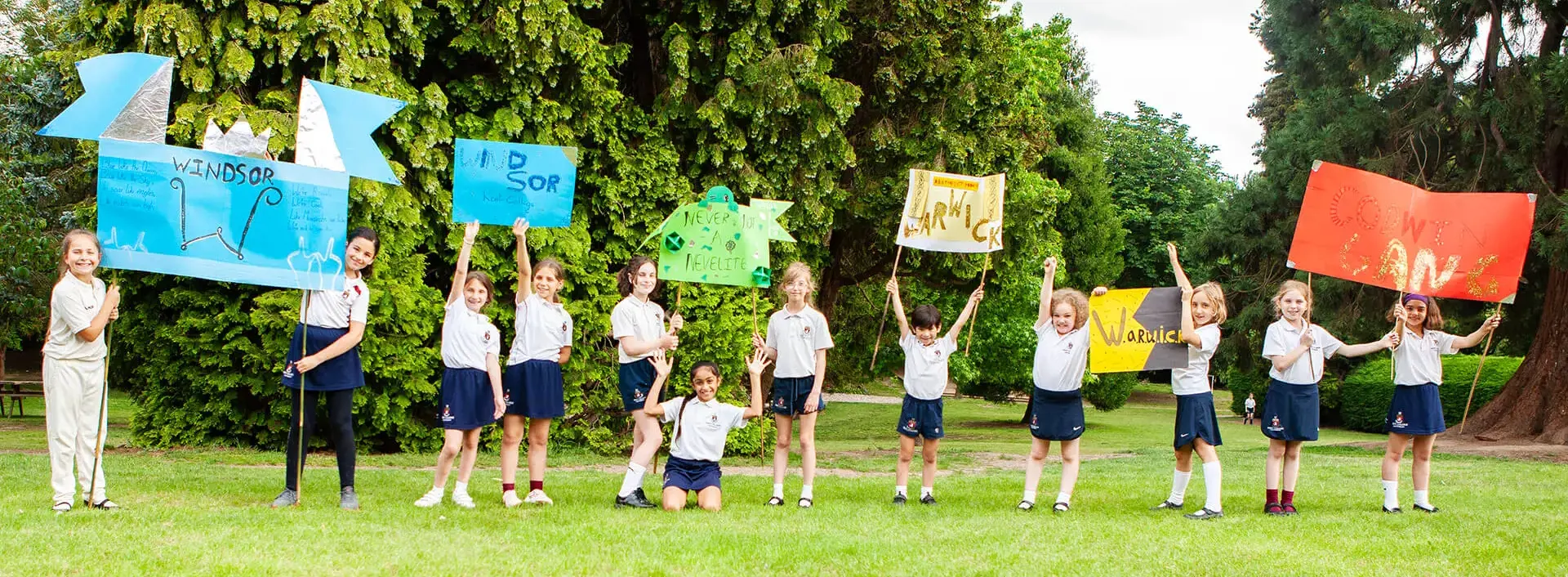 Junior School pupils with handmade House banners