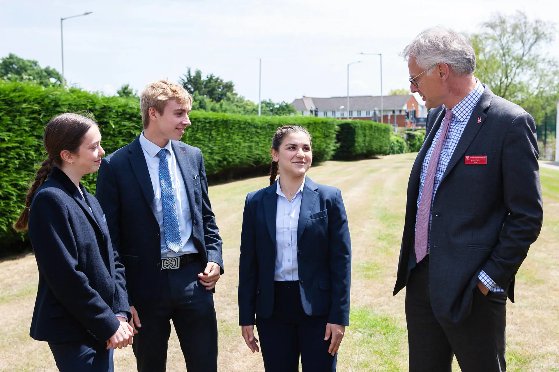 Mark Turnbull, Kent College Canterbury Headteacher, with Sixth Form pupils