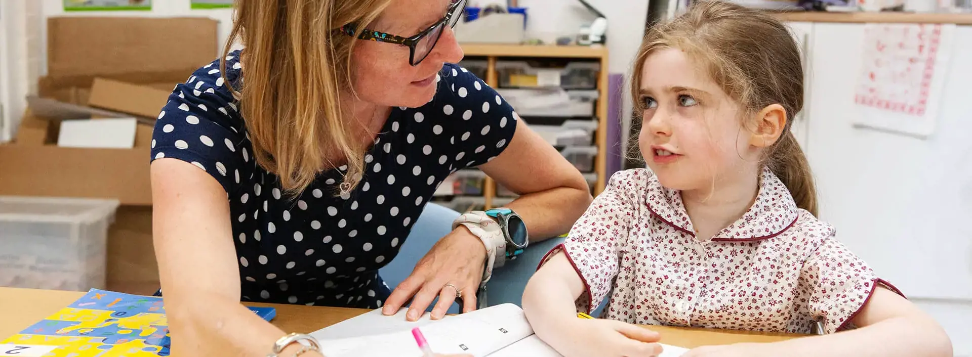 Teacher working with a pupil