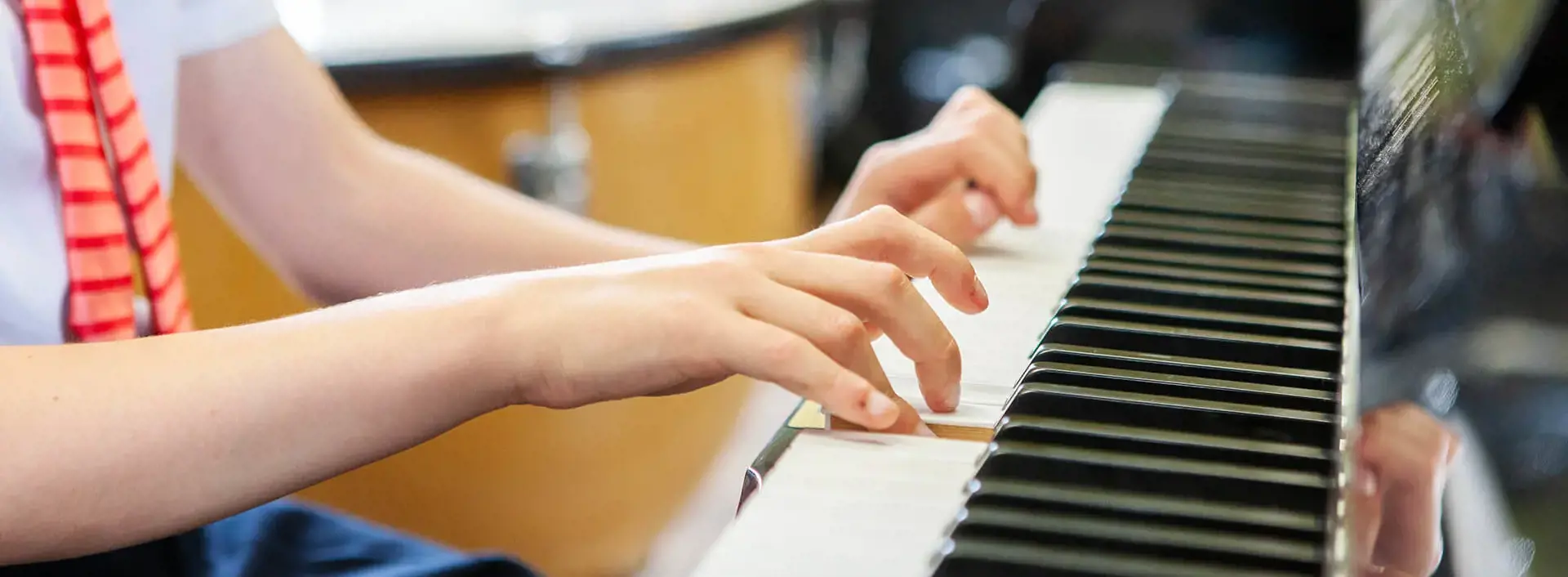 Pupil playing the piano