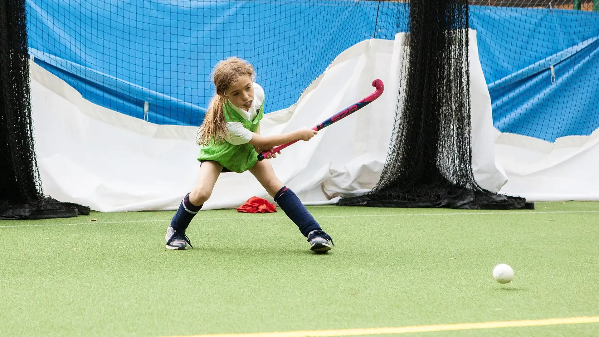 Kent College Junior School girl playing hockey