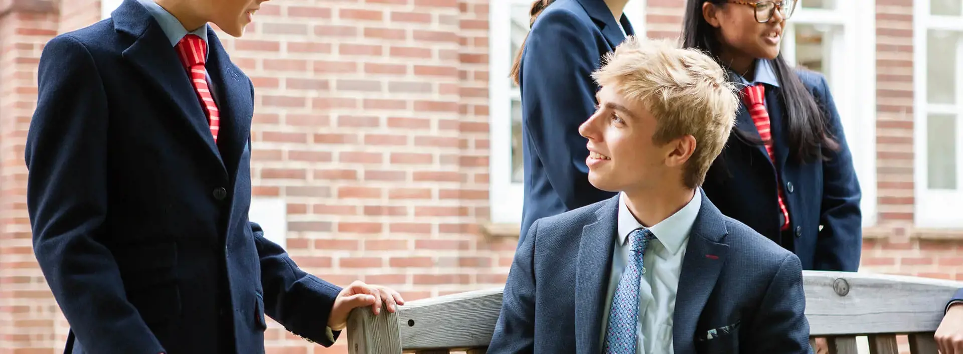 Sixth Form student chatting with a younger pupil