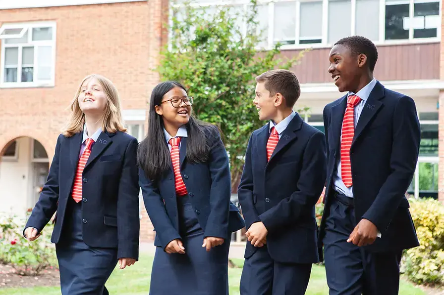 Students walking together in the Kent College Canterbury grounds