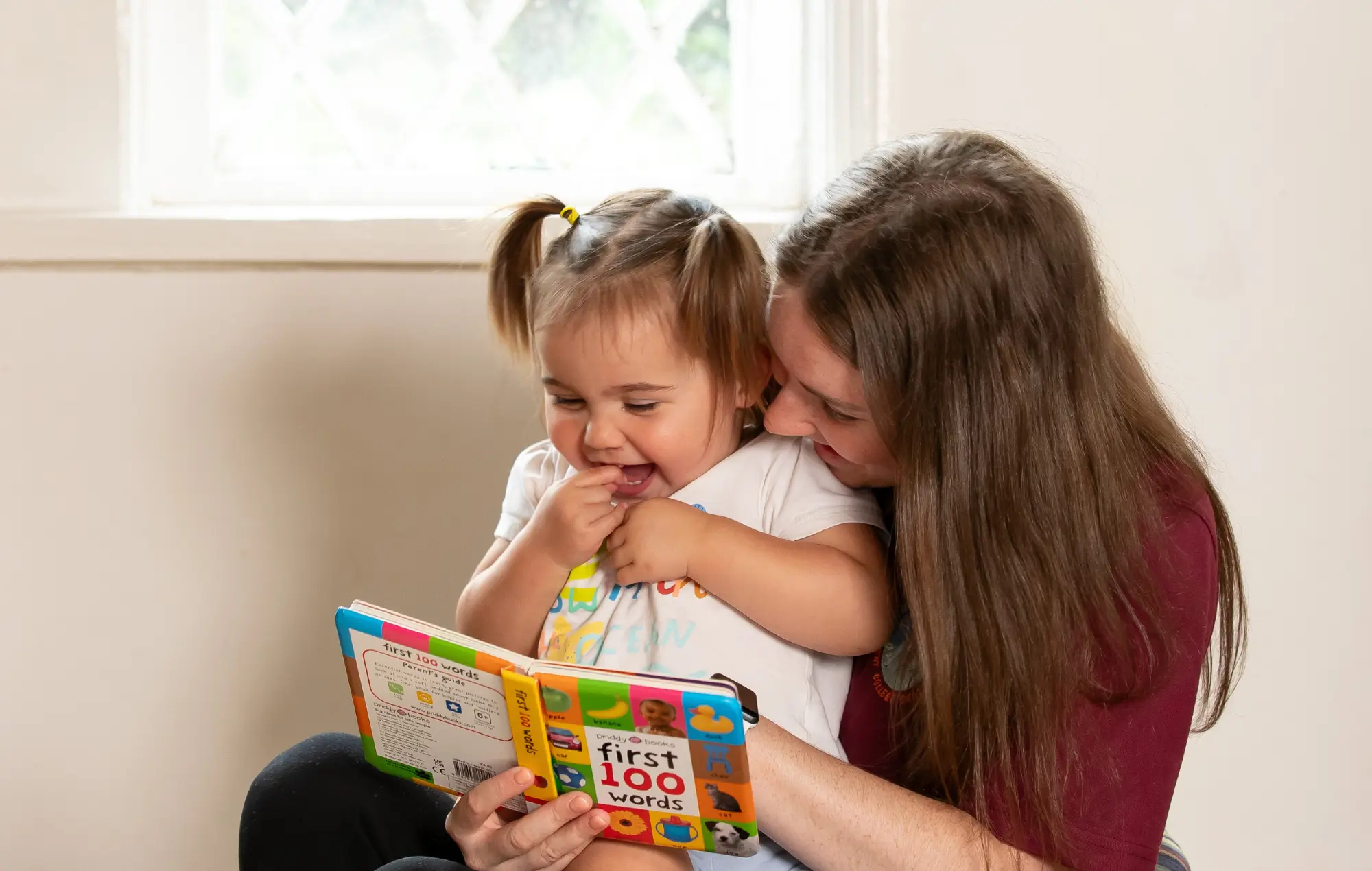 Children reading at Garden Cottage Nursery, at Kent College Canterbury